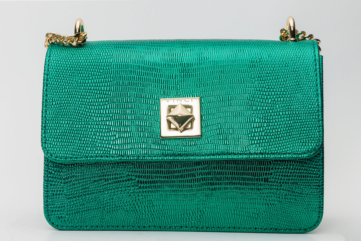 El bolso de mano de piel verde arce